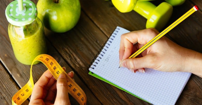 Fitness diet and nutrition routine concept with green detox smoo